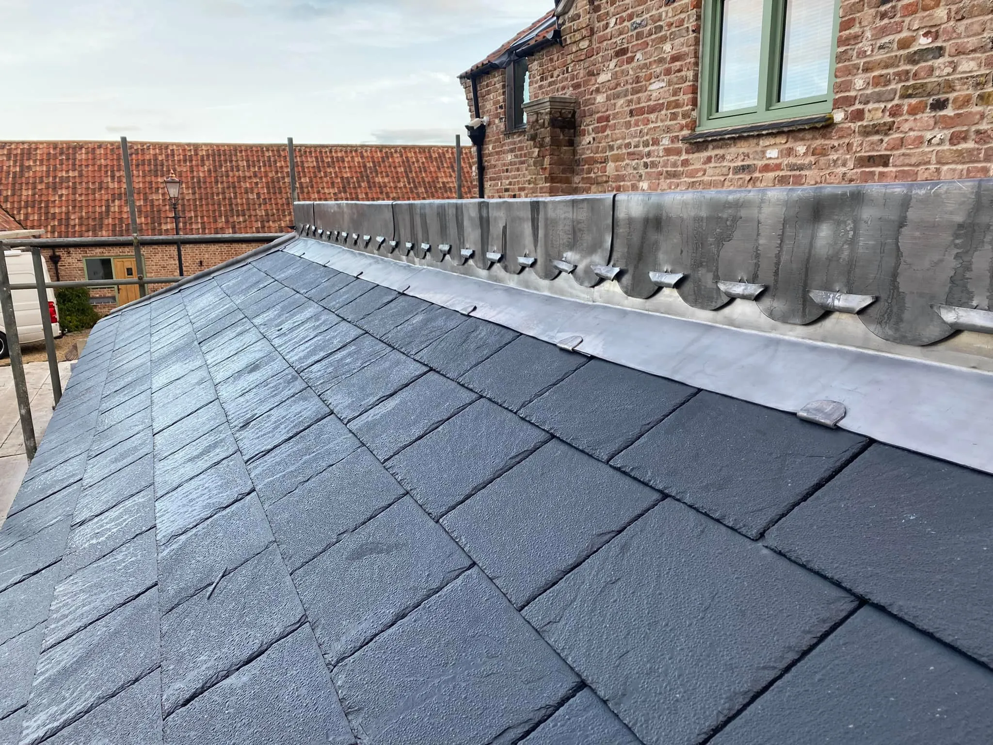 Slate roof with lead parapet gutter completed by New Norfolk Roofing