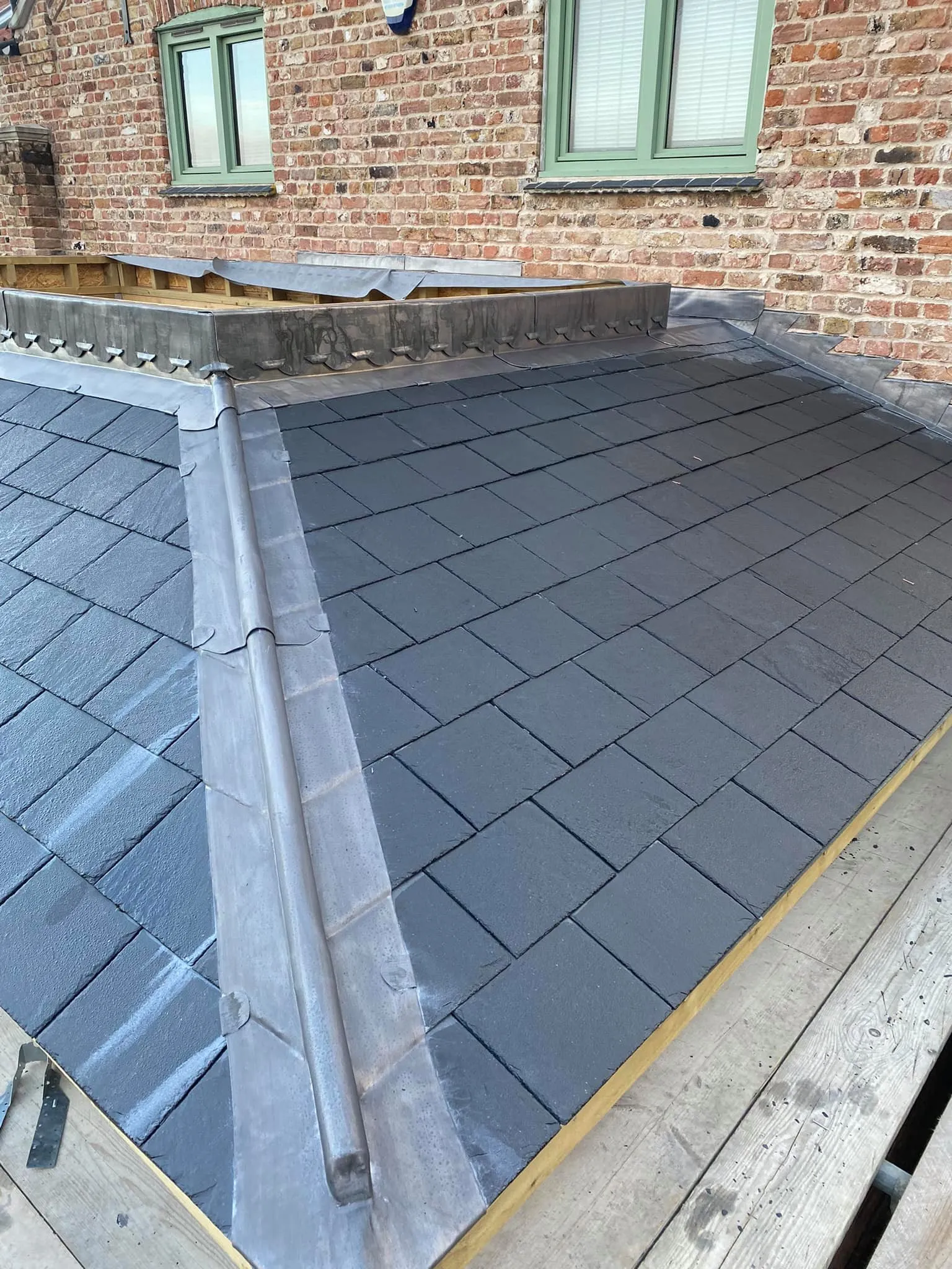 Slate roof with hand-welded lead valley and rolled lead detail